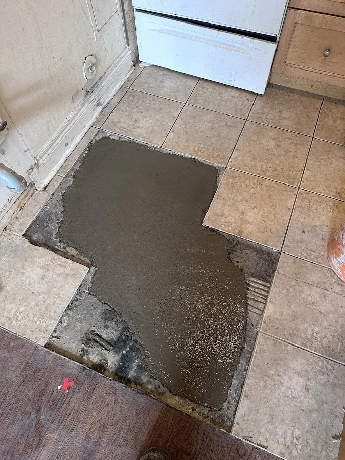 Water-damaged basement flooring being restored with professional drying techniques